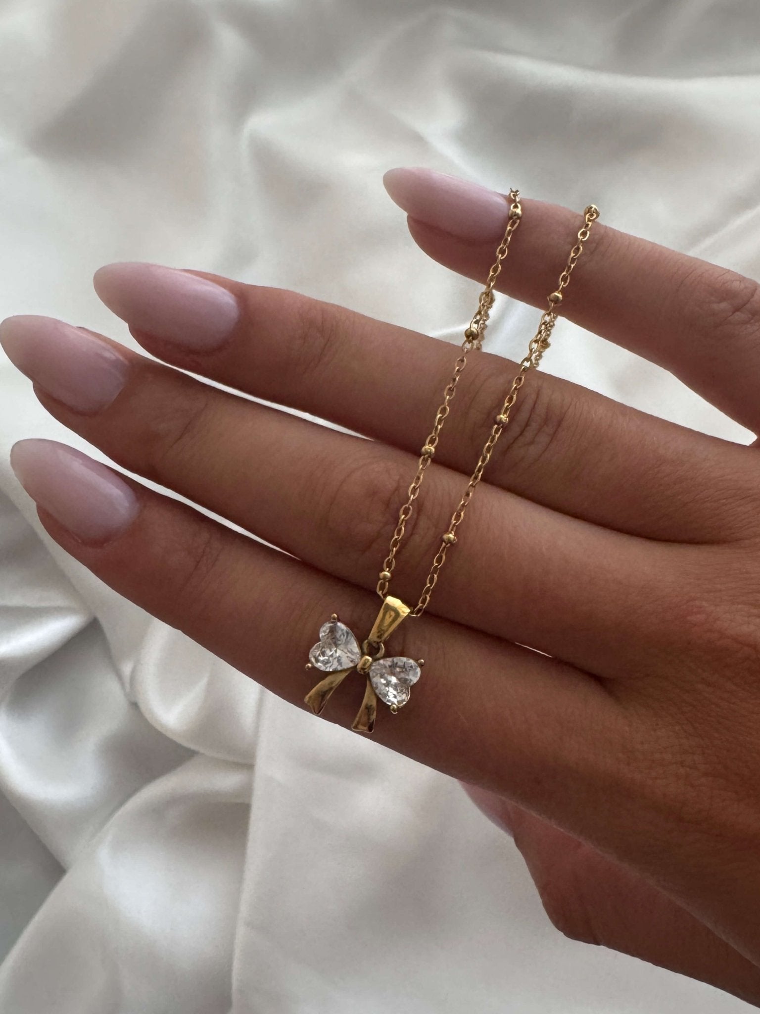 Amara Zirconia Bow Pendant Necklace